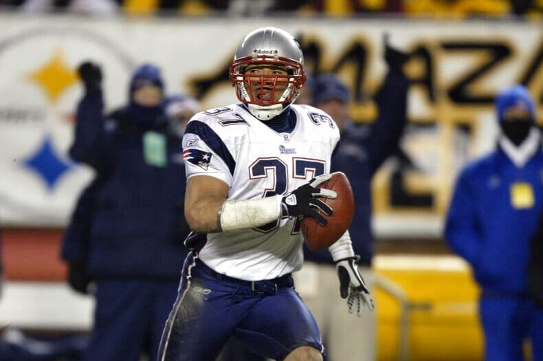 New England Patriots' Rodney Harrison returns an interception 87 yards for a touchdown in the second quarter of the AFC Championship game against the Pittsburgh Steelers Sunday, Jan. 23, 2005, in Pittsburgh. He is one of 25 semifinalists for the Pro Football Hall of Fame Class of 2024. (AP Photo/Stephan Savoia)