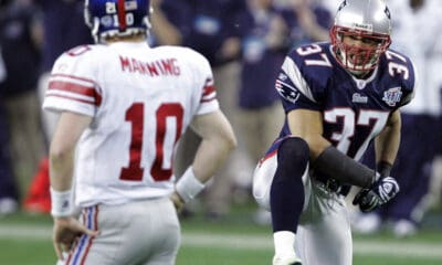 New England Patriots safety Rodney Harrison (37) celebrates following a play as New York Giants quarterback Eli Manning (10) looks on during the second quarter of the Super Bowl XLII football game at University of Phoenix Stadium on Sunday, Feb. 3, 2008 in Glendale, Ariz. Harrison and Manning are both candidates for the Pro Football Hall of Fame Class of 2025. (AP Photo/Elaine Thompson)