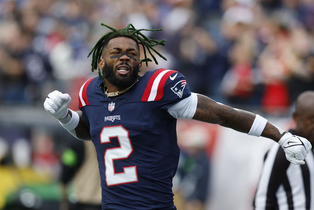 New England Patriots cornerback Jalen Mills (2) gestures while warming up prior to an NFL football game against the Washington Commanders, Sunday, Nov. 5, 2023, in Foxborough, Mass. Mills was Pro Football Focus highest graded defensive player for Week 14 (AP Photo/Michael Dwyer)
