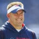 New England Patriots offensive coordinator Josh McDaniels on the field prior to an NFL football game against the New Orleans Saints, Sunday, Sept. 26, 2021, in Foxborough, Mass. (AP Photo/Stew Milne)