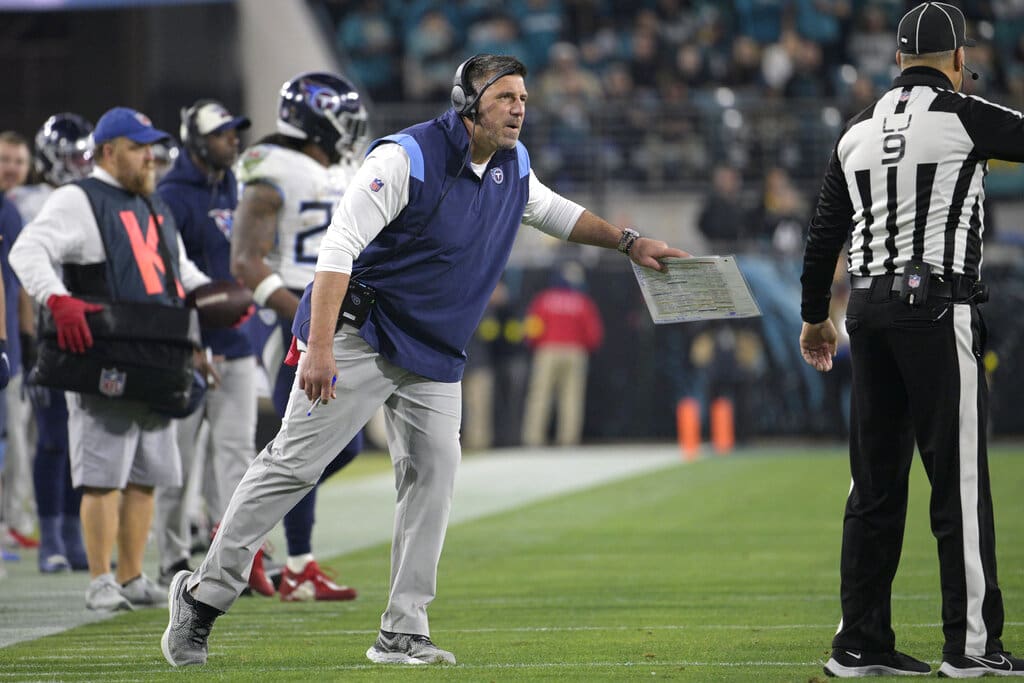 Tennessee Titans head coach Mike Vrabel, New England Patriots Hall of Famer, argues with line judge Mark Perlman (9) during the second half of an NFL football game against the Jacksonville Jaguars, Saturday, Jan. 7, 2023, in Jacksonville, Fla. (AP Photo/Phelan M. Ebenhack)