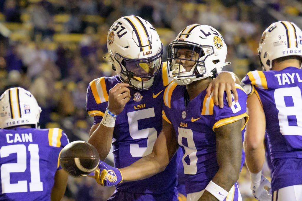 NFL Draft prospects: LSU wide receiver Malik Nabers (8) celebrates after his touchdown with quarterback Jayden Daniels (5) during the first half of an NCAA college football game against Georgia State in Baton Rouge, La., Saturday, Nov. 18, 2023. (AP Photo/Matthew Hinton)