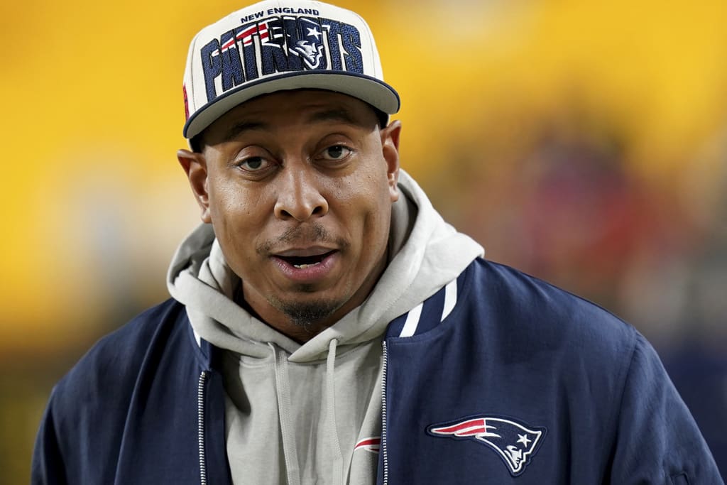 New England Patriots defensive line coach DeMarcus Covington stands on the sidelines before an NFL football game against the Pittsburgh Steelers Thursday, Dec. 7, 2023, in Pittsburgh. (AP Photo/Matt Freed)