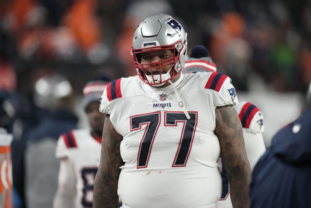 New England Patriots offensive tackle Trent Brown (77) in the first half of an NFL football game in Empower Field at Mile High Sunday, Dec. 24, 2023, in Denver. (AP Photo/David Zalubowski)