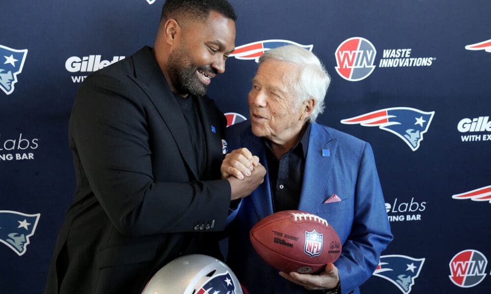 Newly-named New England Patriots head coach Jerod Mayo, left, and Patriots owner Robert Kraft shake hands Wednesday, Jan. 17, 2024, following an NFL football news conference, in Foxborough, Mass. Mayo succeeds Bill Belichick as the franchise's 15th head coach. (AP Photo/Steven Senne)