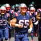New England Patriots offensive lineman James Ferentz (65) runs onto the field during an NFL football game against the Miami Dolphins Sunday, Sept. 11, 2022, in Miami Gardens, Fla. (AP Photo/Doug Murray)