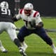 New England Patriots guard Mike Onwenu (71) lines up against the Las Vegas Raiders during the first half of an NFL football game, Sunday, Dec. 18, 2022, in Las Vegas. (AP Photo/Rick Scuteri)