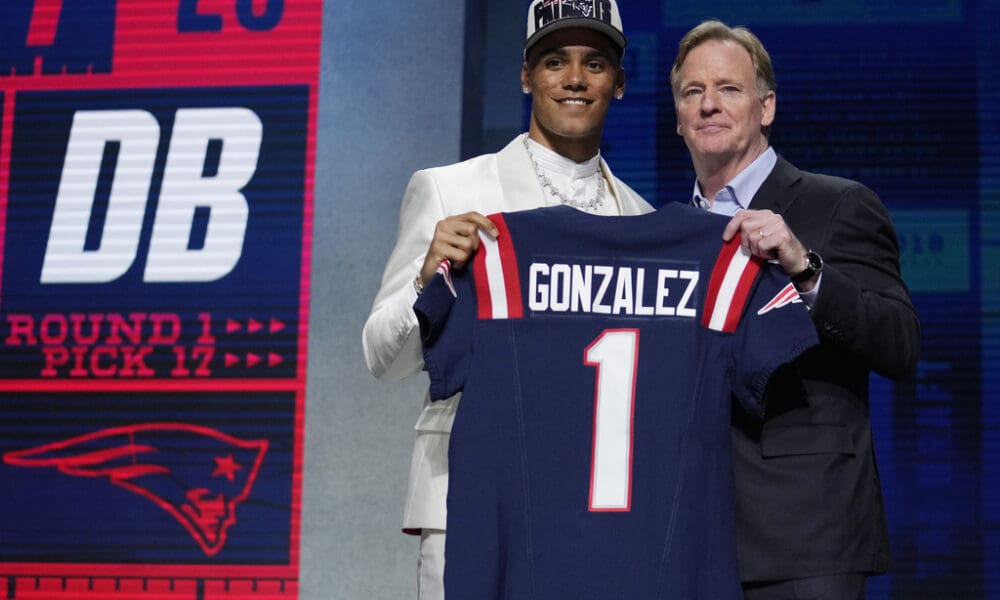 Oregon defensive back Christian Gonzalez, left, poses with NFL Commissioner Roger Goodell after being chosen by the New England Patriots with the 17th overall pick during the first round of the NFL football draft, Thursday, April 27, 2023, in Kansas City, Mo. (AP Photo/Jeff Roberson)