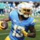 Los Angeles Chargers wide receiver Keenan Allen (13) runs after a catch against the Miami Dolphins during the first half of an NFL football game Sunday, Sept. 10, 2023, in Inglewood, Calif. Allen has been traded, but not to the New England Patriots. (AP Photo/Mark J. Terrill)