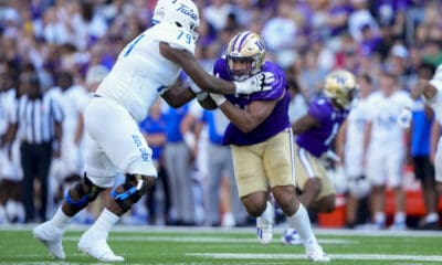 Washington edge Bralen Trice in action against Tulsa offensive lineman Darrell Simpson (79) during an NCAA college football game Saturday, Sept. 9, 2023, in Seattle. (AP Photo/Lindsey Wasson)