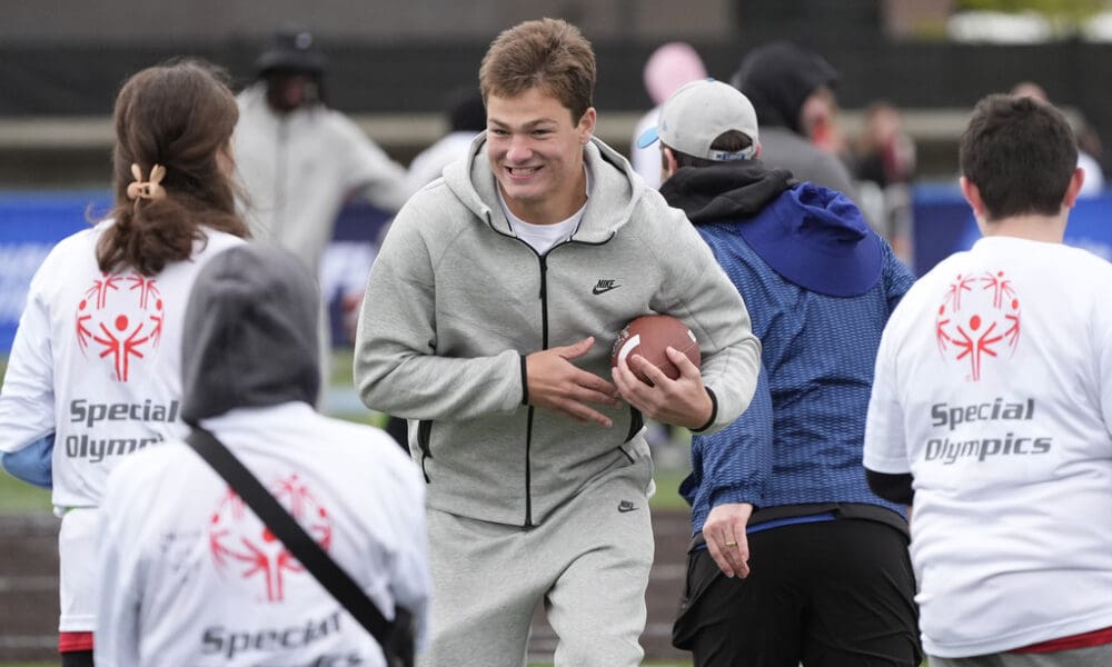 New England Patriots quarterback Drake Maye works with young athletes during an NFL Football Play Football Prospect Clinic with Special Olympics athletes, Wednesday, April 24, 2024 in Detroit. (AP Photo/Carlos Osorio)